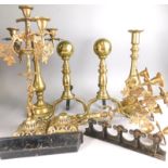 Miscellaneous metalware, to include a pair of fire dogs, a large pair of candlesticks and a pair