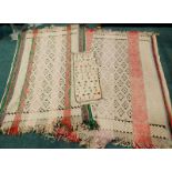 Three South American flat weave hangings, one with geometric design, the other with a design of