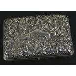 An Indian white metal cigarette case, with embossed and chased decoration of an antelope attacked by