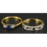 Two dress rings, to include a sapphire and diamond three stone ring, marked 18ct and plat,