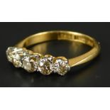 A five stone diamond dress ring, set with five tiny diamonds each approx 0.05cts, yellow metal,