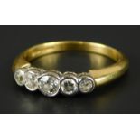 An 18ct gold five stone diamond dress ring, set with five round brilliant cut diamonds, in