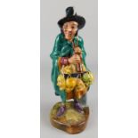 A Royal Doulton porcelain figure of The Mask Seller, HN2103