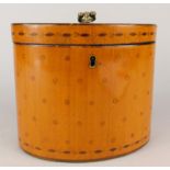 An early 19thC satinwood oval tea caddy, the hinged lid inlaid with roundels and lozenges,