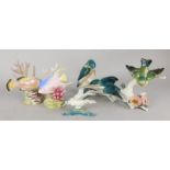 A collection of porcelain animals and fish, to include two Worcester fish, designed by Ronald Van
