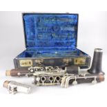 An early 20thC composition clarinet, indistinctly marked in a fitted case