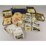 A large quantity of loose cigarette cards, trade cards etc,. to include some sets