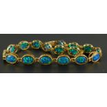 A 9ct gold opal bracelet, set with dark green/blue opal doublets, 5.7g all in.