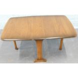 A small Ercol style mid coloured elm Sutherland table or drop leaf coffee table, 58cm wide