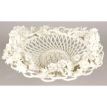 A Continental porcelain two handled basket, with flower and leaf encrusted border, marking and
