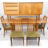 A 1960's/70's teak associated dining suite, the sideboard with three drawers and two cupboard