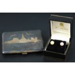 A pair of cultured pearl earring studs, and a Siam sterling niello cigarette box (2)