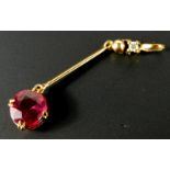 An 18ct gold ruby pendant, with tiny diamond and ball clasp, and oval ruby approx 1.33cts, 1.5g