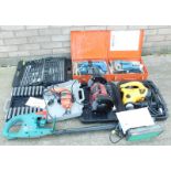 Various Bosch and other power tools, a hedge trimmer, grinder, a drill, and a sander etc.