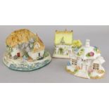 A ceramic fisherman's cottage by Jane King, two Coalport cottages and bird ornaments