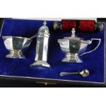 A Mappin & Webb Princes plate Art Deco style three piece cruet, in the a fitted case and a double