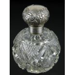 A cut glass scent bottle, with embossed silver hinged lid and collar, Birmingham assay, date