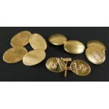 Three pairs of 9ct gold cufflinks, each oval with engine turn design, 17.1g all in.