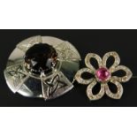 Two brooches, to include a silver brooch set with smoky quartz, and a floral brooch, with central