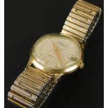 An Accurist gent's wristwatch, on an expanding bracelet, on cream dial, in a yellow metal watch