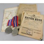 Miscellaneous militaria, to include a ration book, a military type map, two second World War 39-45