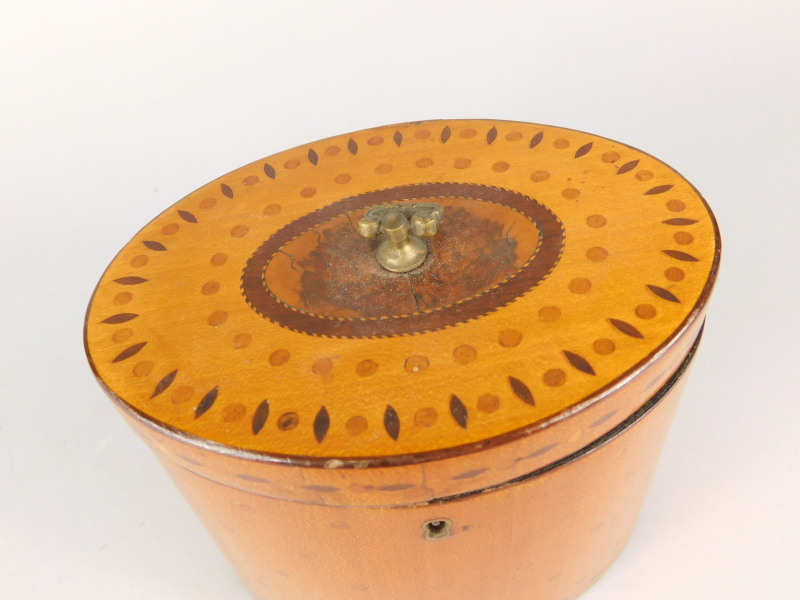 An early 19thC satinwood oval tea caddy, the hinged lid inlaid with roundels and lozenges, - Bild 2 aus 3