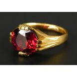 A ruby set dress ring, the oval cut ruby approx 3.55cts, with three row claw setting, yellow