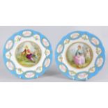 A pair of 20thC Serves style plates, each painted with figures, within turquoise and flower