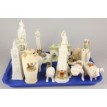 A collection of crested china, to include a lighthouse, a ram's figure, a Skegness fireplace, etc.