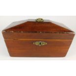 A 19thC mahogany sarcophagus shaped tea caddy, with metal cast handles