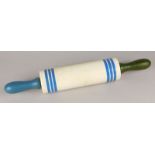 An early 20thC Sadler pottery rolling pin, decorated with plain blue bands on a cream ground with