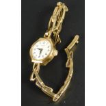 A 9ct gold cased Rotary ladies' wristwatch, on a 9ct gold expanding bracelet