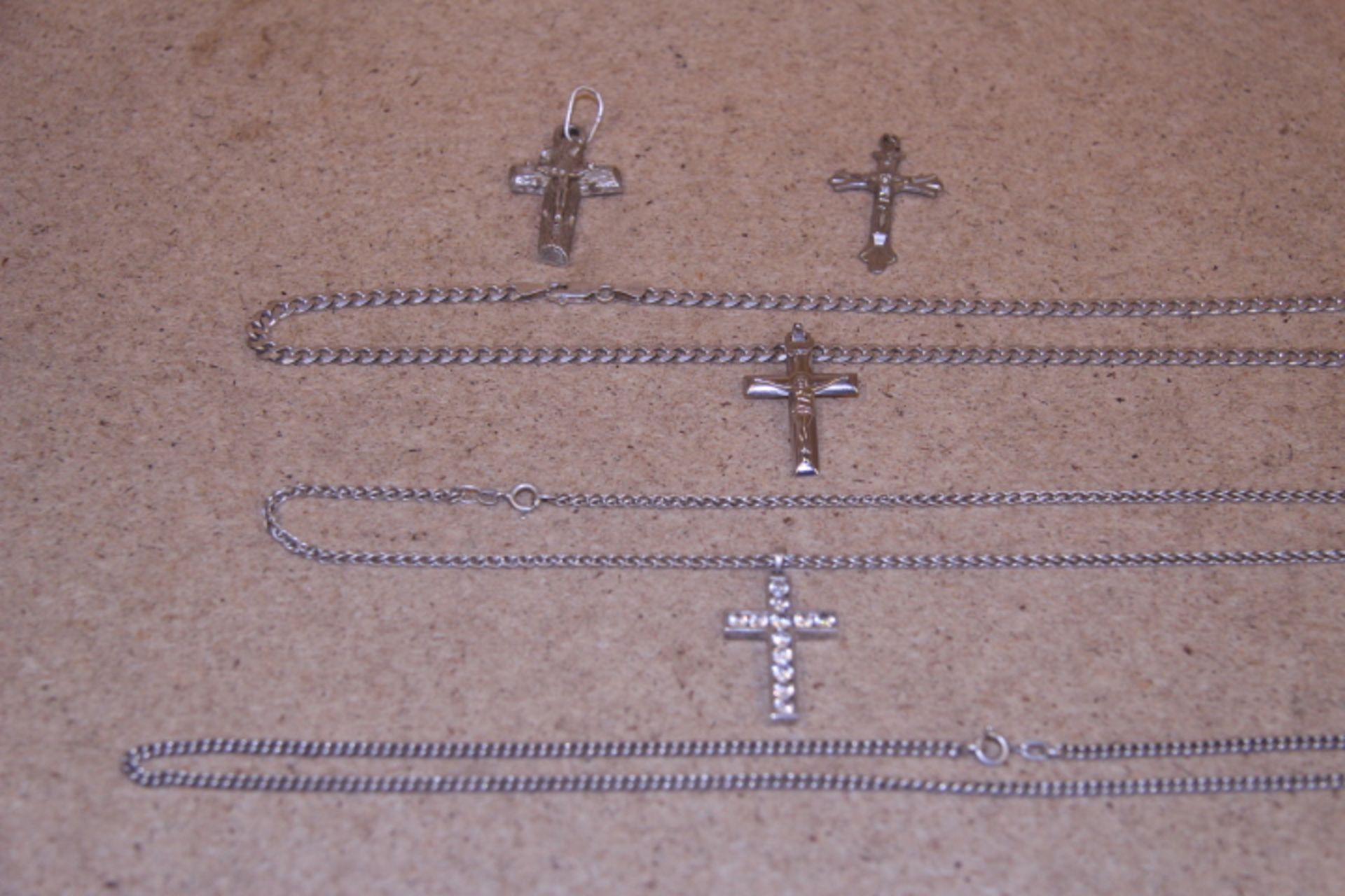 Grade U A Lot Of Three Silver/WM Chains & Four Silver/WM Crosses (49.3g)