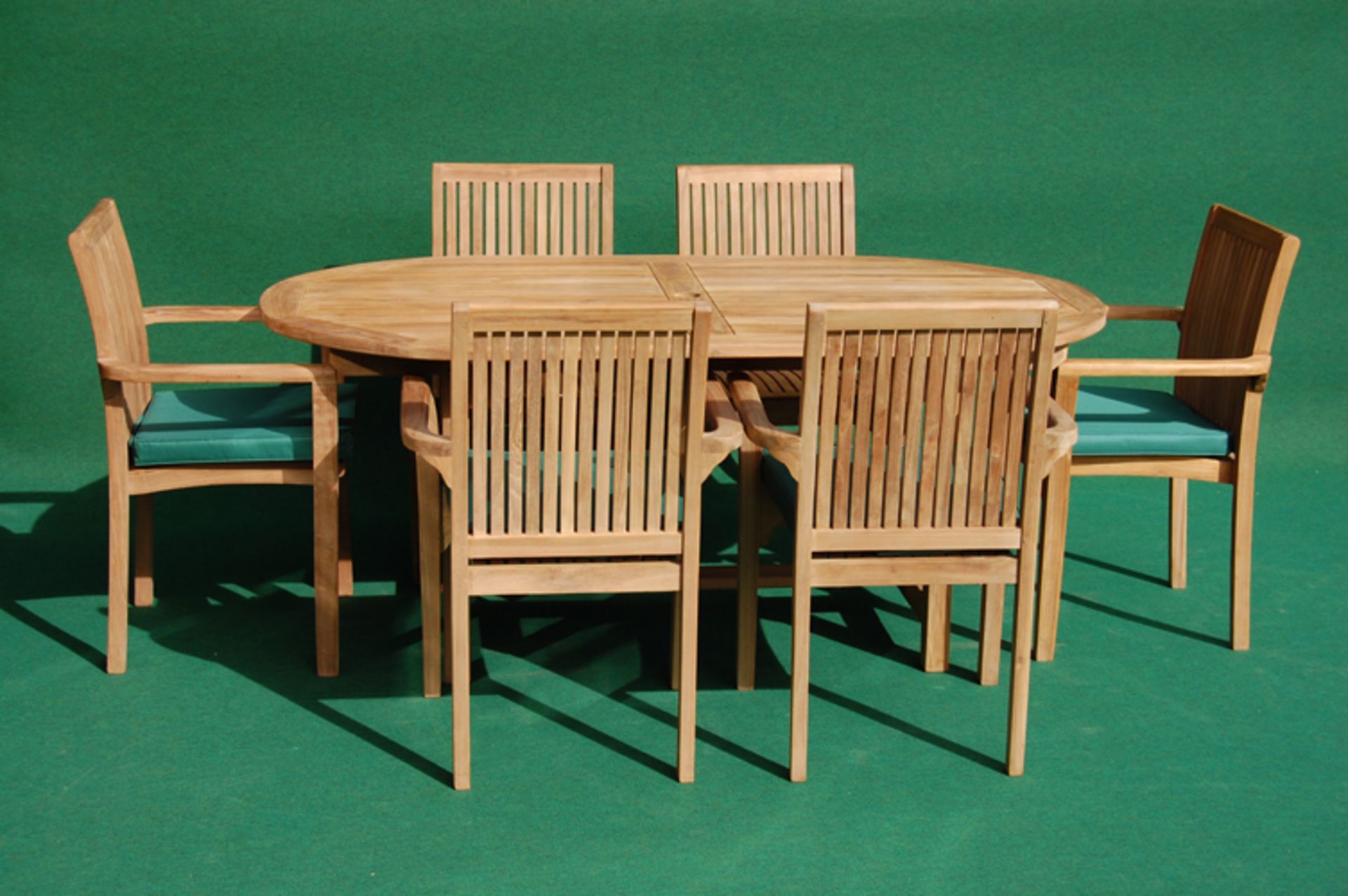V Brand New Teak Fixed Oval Table Set Allows For Up To 6 People including 6 stacking chairs and 6