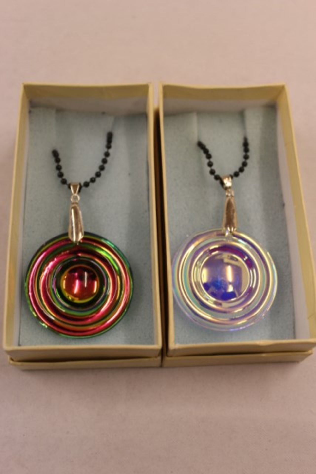 Two Disc Pendants On Chains