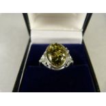 A Silver ring with Green Amber Stone