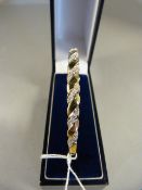 A 9ct Gold Bangle set with diamonds - total weight 9.8g