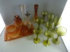 A quantity of coloured glass ware to include a dressing table set