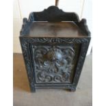 A Carved oak Victorian coal scuttle with spade to back