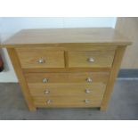 An oak chest of three drawers