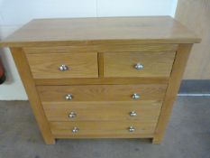 An oak chest of three drawers