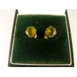 A Pair of 9ct Gold and Peridot studs