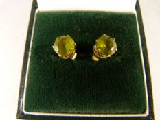 A Pair of 9ct Gold and Peridot studs