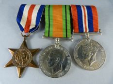 A Defense medal, War Medal and a French and Germany Star