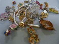 A small quantity of costume jewellery to include mainly brooches, Rolled Gold watch strap and a