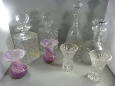 Four various decanters and a pair of Isle of Wight glass vases