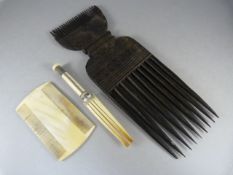 An African tribal hardwood comb and two worked ivory combs