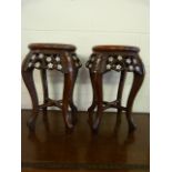 A Pair of foliate decorated tables inlaid with mother of pearl