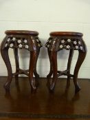 A Pair of foliate decorated tables inlaid with mother of pearl