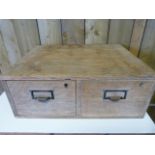 An oak chest of two drawers